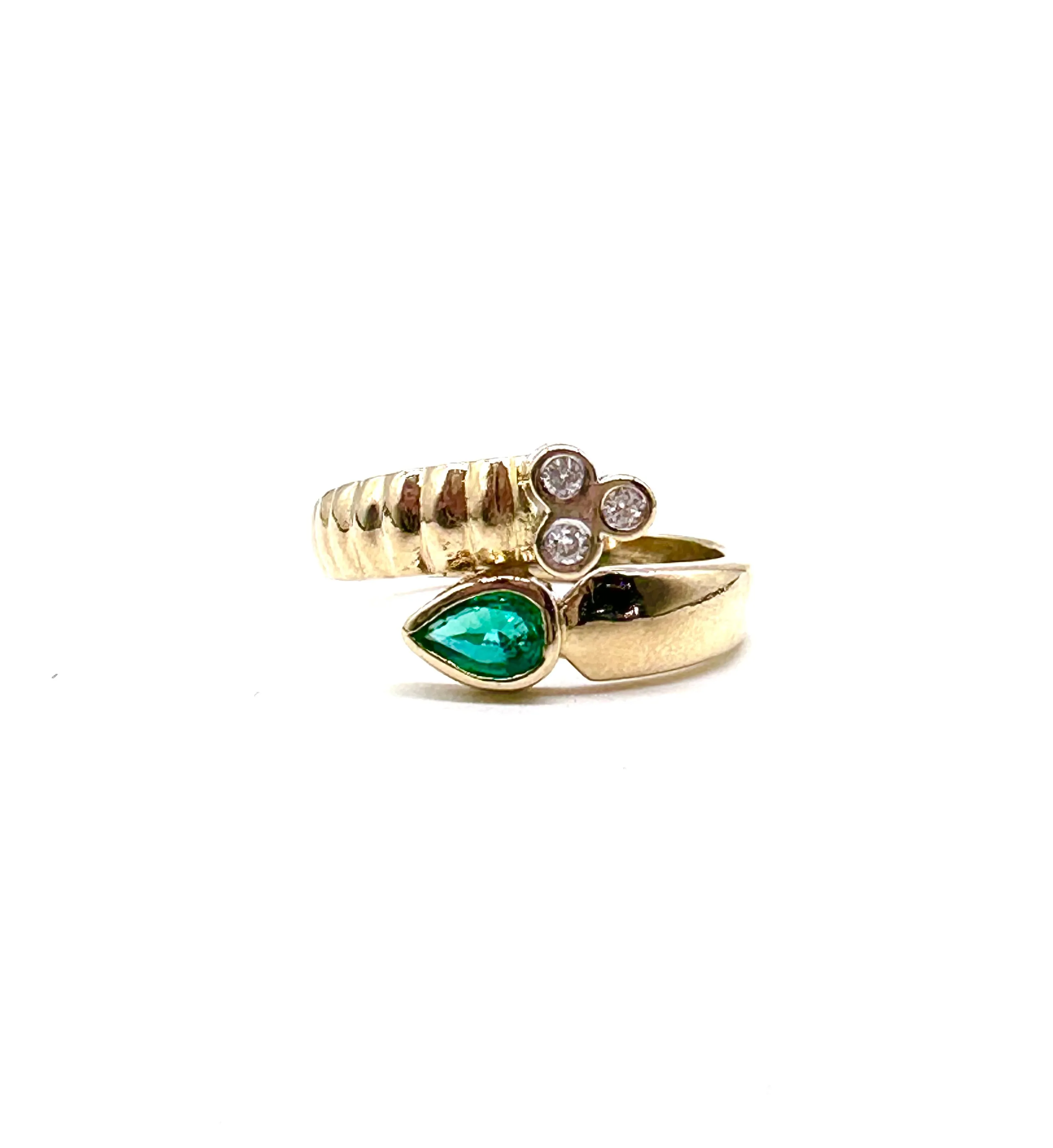 Emerald and diamond bypass ring