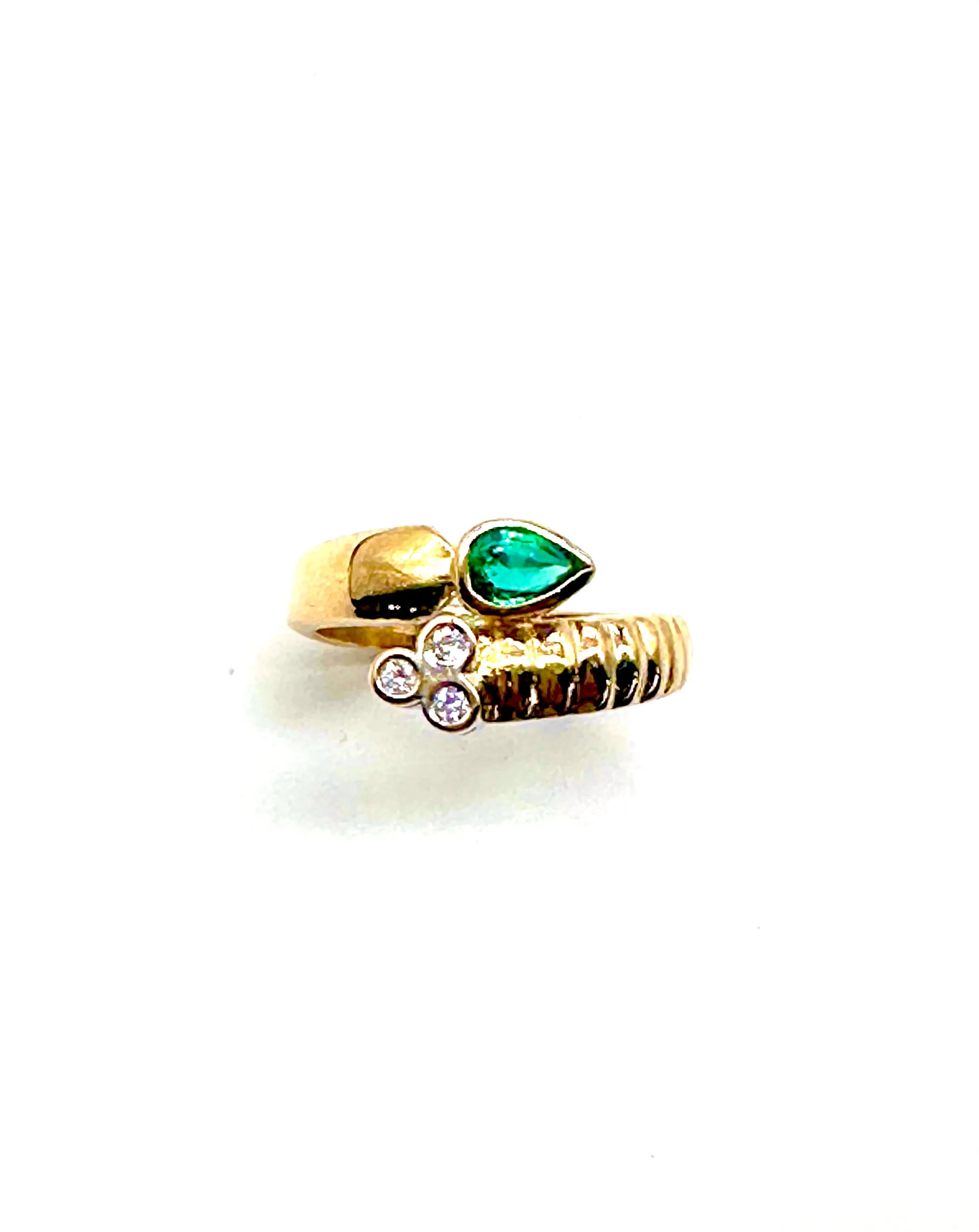 Emerald and diamond bypass ring
