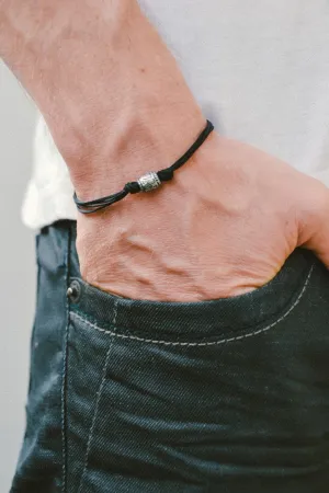 Men's bracelet with a silver aztec tribal bead and a black cord