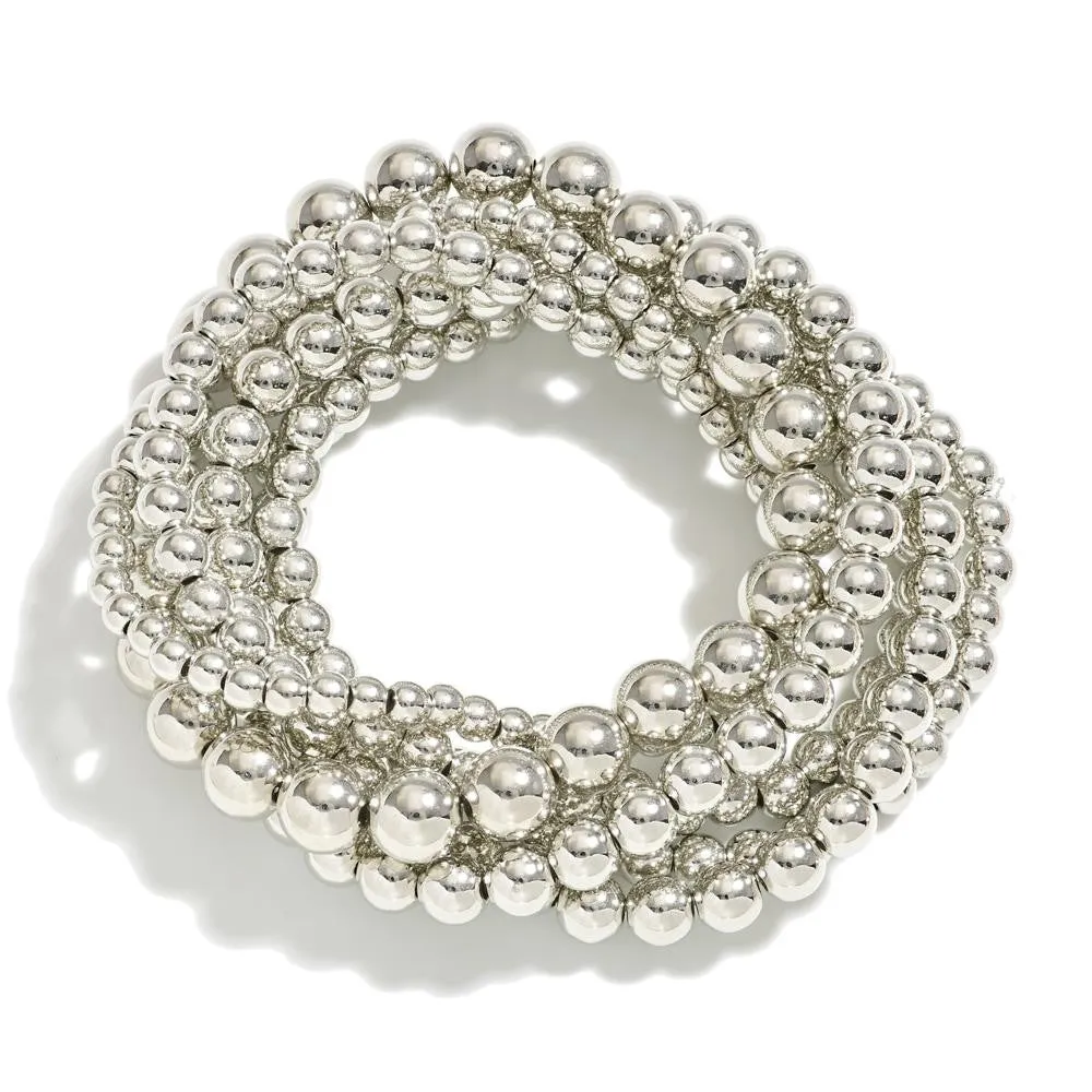 NB Set of Five Metal Tone Beaded Stretch Bracelets