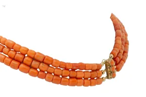 Three strand coral collier with 14 carat gold clasp